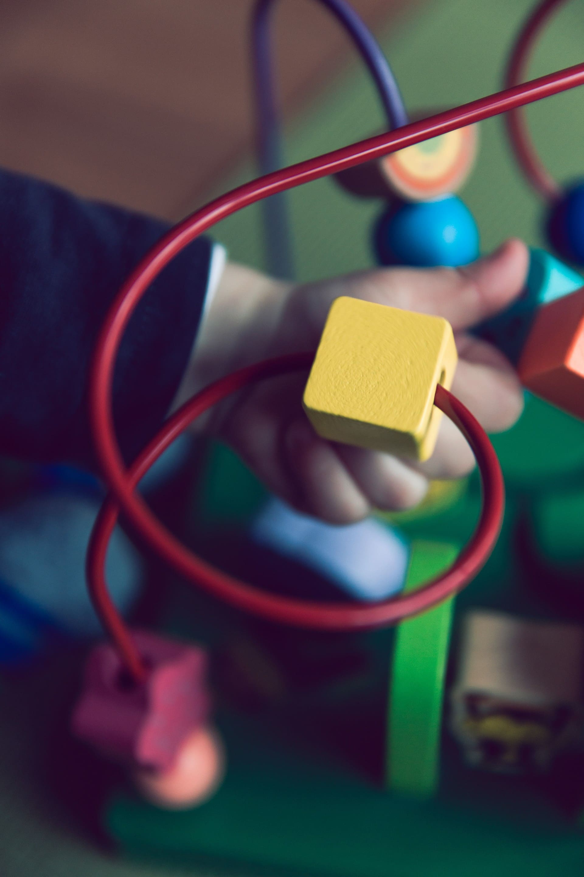Child playing with a maze toy